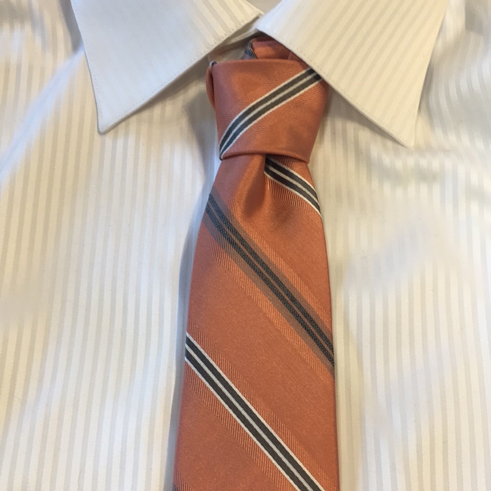 DKNY peach with gray and white diagonal stripe tie. Silk and viscose.